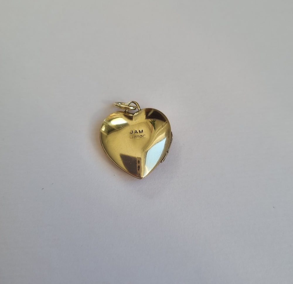 Gold heart locket, engraved and set with a round diamond
