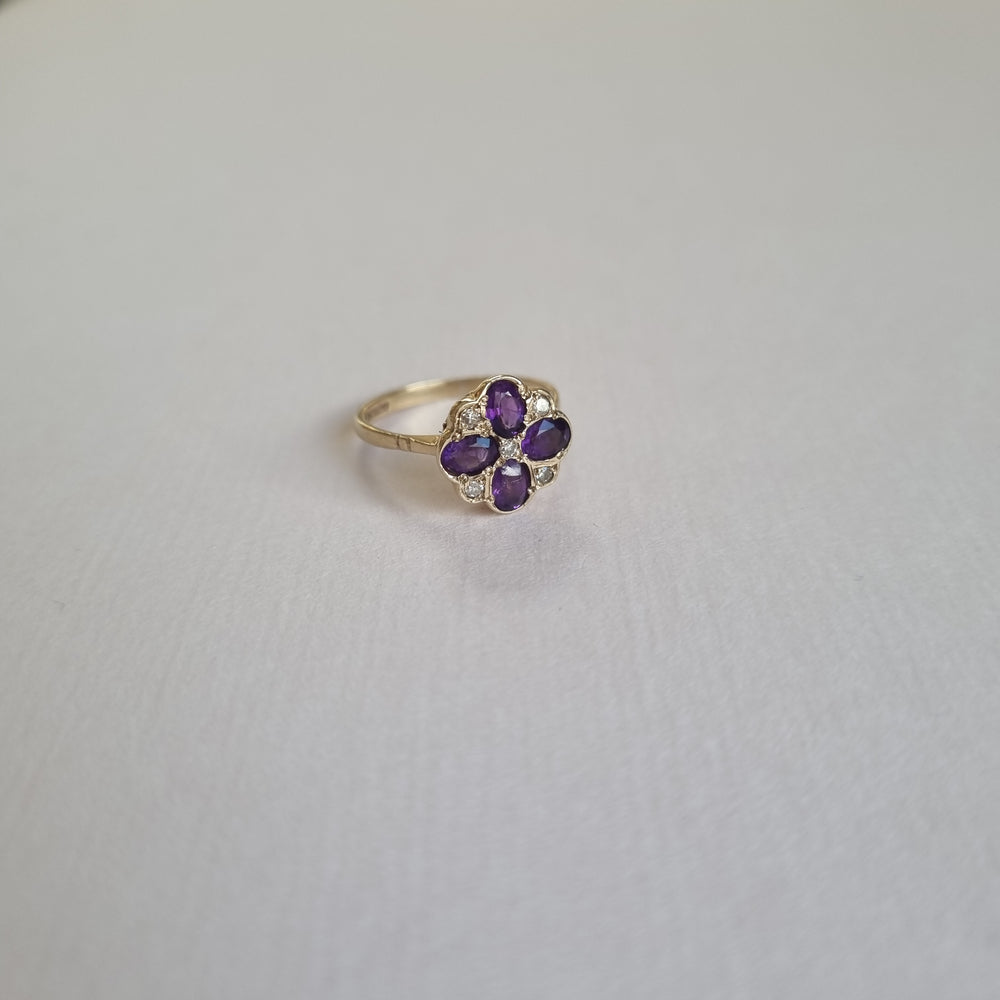 Amethyst and diamond clover with four oval leaves in 9kt gold
