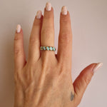 Wavy opal band ring in 9kt gold
