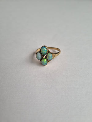 Opal clover with four oval leaves in 9kt gold engraved setting