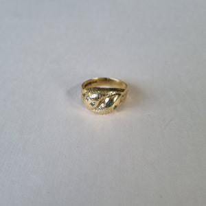 Snake ring with diamond and emerald eyes