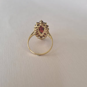 Marquise-cut garnet cluster ring in 9kt gold