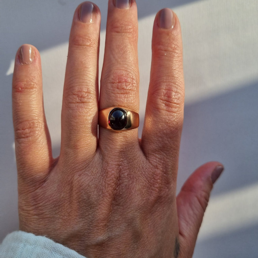 
                
                    Load image into Gallery viewer, Garnet cabochon signet ring in 14kt rose gold
                
            