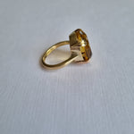 Large oval-cut citrine in claw setting