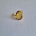 Large oval-cut citrine in claw setting