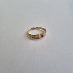 Ruby and diamond 7 stone band ring 18kt