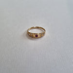 Ruby and diamond 7 stone band ring 18kt