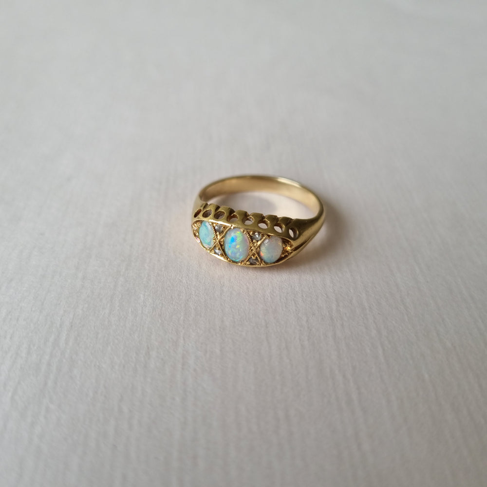 
                
                    Load image into Gallery viewer, Opal boat ring inter spaced by tiny diamonds
                
            