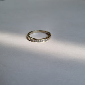 White 18kt gold half band with 10 square diamonds