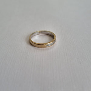 
                
                    Load image into Gallery viewer, White 18kt gold half band with 17 baguette-cut diamonds
                
            