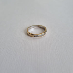 
                
                    Load image into Gallery viewer, White 18kt gold half band with 17 baguette-cut diamonds
                
            