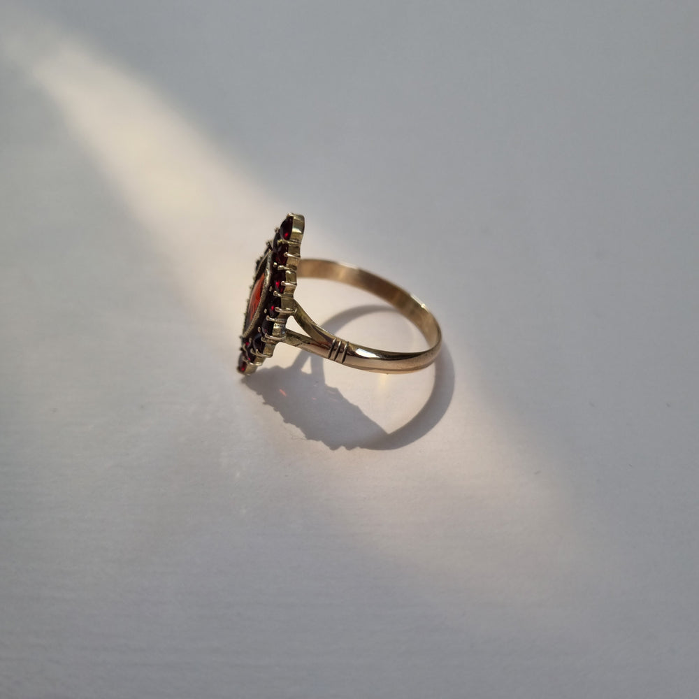 
                
                    Load image into Gallery viewer, Marquise-cut garnet ring in 9kt gold
                
            