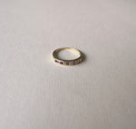 9kt gold half band with 5 square ruby and 4 round-cut diamonds